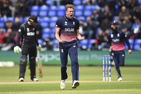 England's Jake Ball celebrates taking the wicket of New Zealand's Luke Ronchi, during the ICC Champions Trophy, Group A cricket match between England and New Zealand in Cardiff. | AP