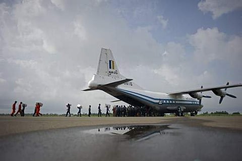This file iamge shows a Myanmar Air Force Shaanxi Y-8 transport aircraft being unloaded at Sittwe airport in Rakhine state, similar to the aircraft carrying over 100 people that went missing between the southern city of Myeik and Yangon on June 7. (File P