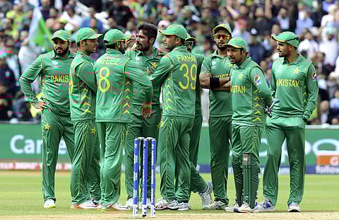 Pakistan players wait for a third umpire decision on South Africa's David Miller LBW appeal during the ICC Champions Trophy match between Pakistan and South Africa at Edgbaston in Birmingham. | AP