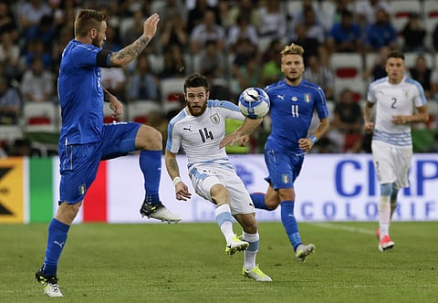 Uruguay's Nahitan Nandez, center, kicks the ball during a friendly soccer match between Italy and Uruguay, at the Nice Allianz Riviera stadium, France. | AP