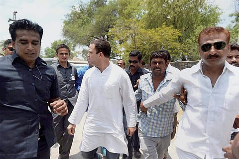 Congress vice-president Rahul Gandhi on his way to meet the families of the five farmers who were killed in police firing. (PTI)