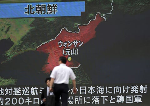 A screen shows a news program reporting about North Korea's missile firing from Wonsan, center, Thursday, June 8, 2017, in Tokyo. (AP)
