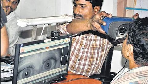 A man undergoing iris scan for Aadhaar enrolment