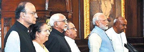 (L-R) Finance Minister Arun Jaitley, Lok Sabha Speaker Sumitra Mahajan, Vice President Hamid Ansari, President Pranab Mukherjee, Prime Minister Narendra Modi and former PM HD Devegowda in the Central Hall of Parliament, after the launch of Goods and Servi