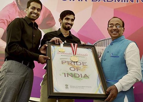 Sports Minister Vijay Goyal felicitates badminton star Kidambi Srikanth, the winner of Indonesian and Australian Open Super Series 2017, and ace coach P Gopichand in New Delhi on July 1. (Photo | PTI)