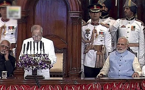 President Pranab Mukherjee addresses the special ceremony in the Central Hall of Parliament for the launch of 'Goods and Services Tax GST ' in New Delhi on Saturday. Prime Minister Narendra Modi is also seen. (PTI)