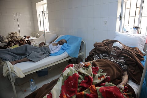 FILE -- In this May. 15, 2017 file photo, people are treated for suspected cholera infection at a hospital in Sanaa, Yemen. | AP