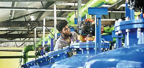 A worker gives finishing touches to the plant that will treat water from Porur lake. It will be inaugurated on Tuesday | Martin Louis