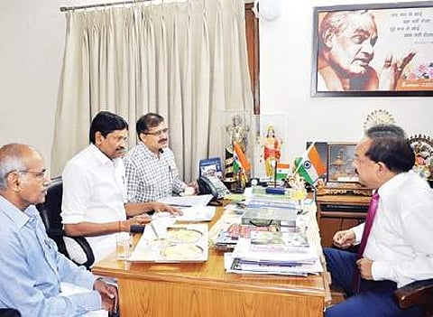 M C Sampath in a meeting.