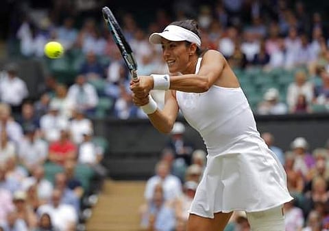 Spain's Garbine Muguruza returns to Slovakia's Magdalena Rybarikova during their Women's Singles semifinal match on day nine at the Wimbledon. | AP