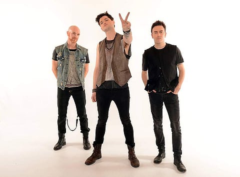 Boy band The Script, from left, Mark Sheehan, Danny O'Donoghue and Glen Power are seen backstage at BBC's Children in Need at Television Centre on Friday, Nov. 16, 2012, in London. (Photo: Jon Furniss/Invision for Children in Need/ AP Images)