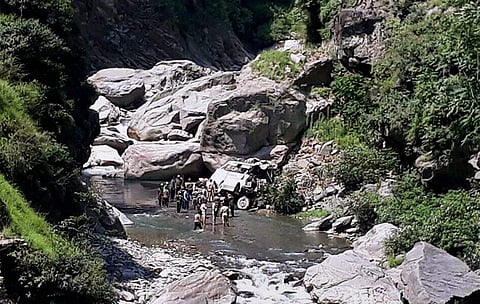 Security personnel carry out rescue work after a bus carrying Amarnath pilgrims falls into gorge off Jammu-Srinagar National Highway in Ramban district on Sunday. | PTI