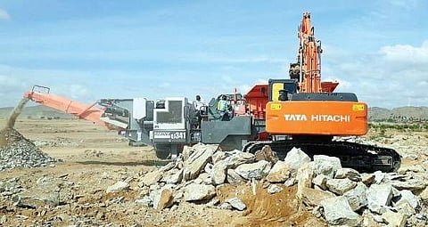 An earthmover busy in the ground levelling works at the project site of the proposed KIA Motors car manufacturing plant, at Yerramanchi village of Penukonda mandal in Anantapur district on Saturday | Express