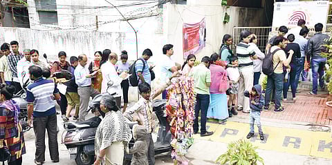 Serpentine queues of people waiting outside Aadhaar enrolment centres, like this one on Vanivilas Road, are a common sight these days | nagaraja gadekal