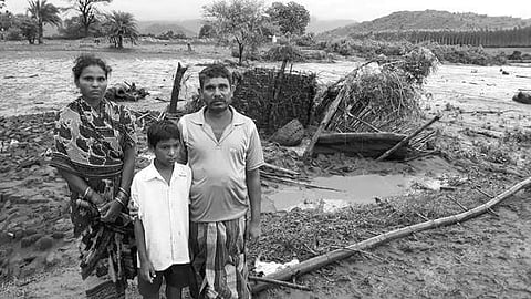 Gauranga Samal with his family in front of his damaged house in Kalyansighpur | Express