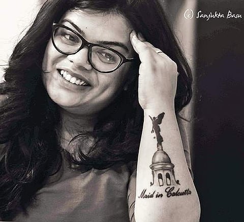 One of her photos featuring a tattooed woman