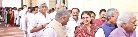 Union ministers Maneka Gandhi and V K Singh (left, foreground) as well as other Members of Parliament stand in a queue to cast their vote during the presidential election, at Parliament House in New Delhi on Monday | Shekhar Yadav