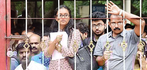 Students wait outside the CET cell during counselling in Malleswaram in Bengaluru on Monday | Vinod Kumar T