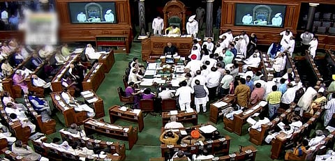 A view of the Lok Sabha as opposition members raise protest in the well of the House in New Delhi on Wednesday. | PTI