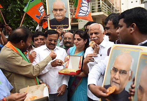 Karanataka BJP workers celebrating president elect Sri Ramanath kovind at Malleswaram in Bengaluru on Thursday. (Nagaraja Gadekal | EPS)