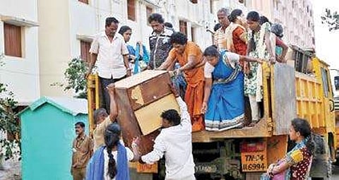A file photo shows resettled families unpacking their belongings near Perumbakkam | Express