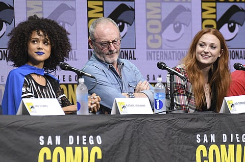 Nathalie Emmanuel, Liam Cunningham, and Sophie Turner who plays Missandei, Davos Seaworth and Sansa Stark respectively in HBO's 'Game of Thrones' series attend the panel on day two of Comic-Con International. (AP)