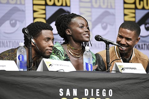 Chadwick Boseman, from left, Lupita Nyong'o, and Michael B. Jordan attend the 'Marvel' panel on day 3 of Comic-Con International on Saturday, July 22, 2017, in San Diego. (Photo by Richard Shotwell/Invision/AP)