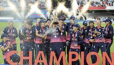 England players celebrate with trophy after winning the ICC Women's World Cup 2017 final match against India at Lord's in London England Sunday July 23 2017. | AP