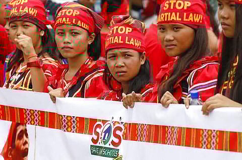 Young Indigenous People known as Lumads display a banner as they join a march of thousands of protesters to coincide with the state of the nation address of the Philippine president in Quezon city on July 24. (File Photo | AP)