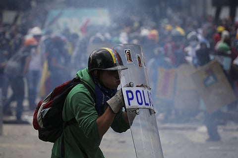 An anti-government protester during clashes with security forces preventing a march to the Supreme Court opposing President Nicolas Maduro's plan to rewrite the constitution. (AP)