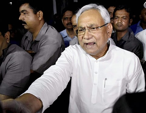 Bihar Chief Minister Nitish Kumar speaks to the media after meeting Governor KN Tripathi in Patna on Wednesday. | PTI