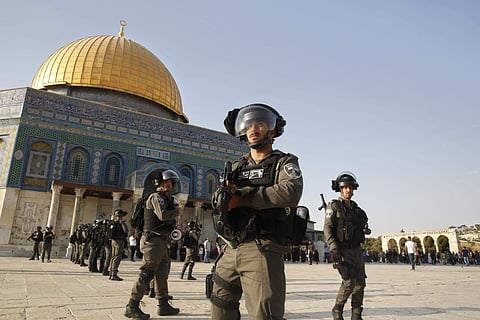Israeli border police officers stand next to the Dome of the Rock mosque at the Al Aqsa Mosque compound (AP)
