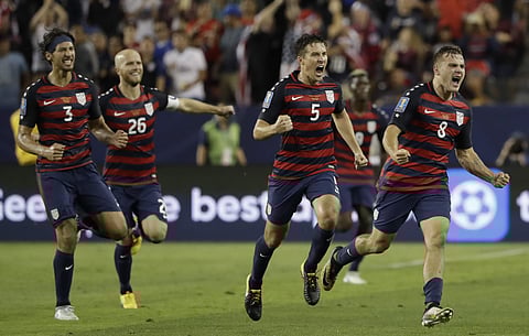 United States' Jordan Morris (8) celebrates with teammates after scoring a goal against Jamaica during the second half of the Gold Cup final soccer match in Santa Clara. | AP