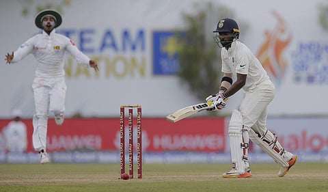 India's Abhinav Mukund attempts to stop the ball being hit the wicket during the third day's play of the first test cricket match between India and Sri Lanka in Galle Sri Lanka Friday July 28 2017. | PTI