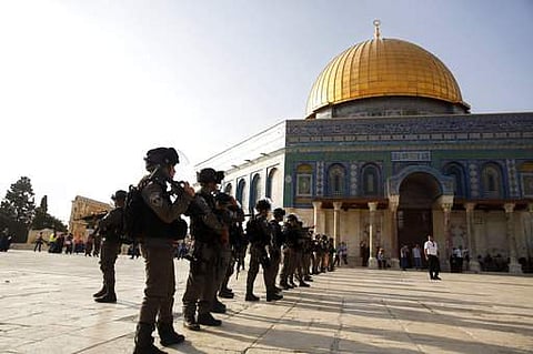 Israeli border police officers stand near the Dome of the Rock Mosque in the Al Aqsa Mosque compound in Jerusalem's Old City|AP