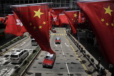 China and Kong Hong national flags are displayed outside a shopping center in Hong Kong Wednesday, June 28, 2017 to mark the 20th anniversary of Hong Kong handover to China. (Photo | Associated Press)