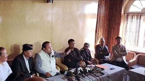 Gorkha National Liberation Front spokesperson Neeraj Zimba speaks as Gorkha Janmukti Morcha general secretary Roshan Giri and other party leaders look on at a press conference in Darjeeling. | Express