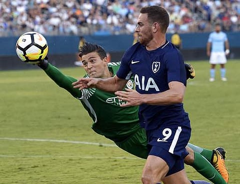 Manchester City goalkeeper Arijanet Muric, left, blocks a shot by Tottenham Hotspur forward Vincent Janssen (9) during the second half of an International Champions Cup match Saturday, July 29, 2017, in Nashville, Tenn. (AP Photo/Mark Zaleski)