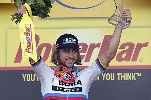 Stage winner Peter Sagan of Slovakia celebrates on the podium after the third stage of the Tour de France cycling race. | AP