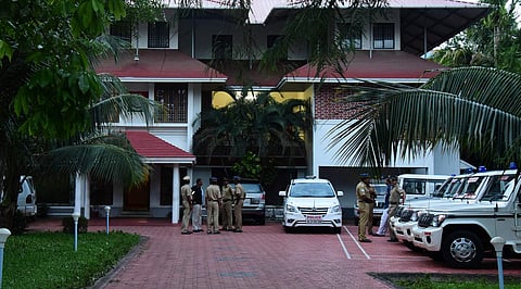 Police officers waiting in front of Aluva Police Club to attend the review meeting in the actor abuse case on Tuesday; (Right) IG Dinendra Kashyap arriving to review the case | Albin Mathew