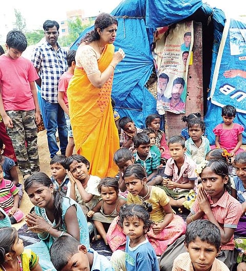 Child panel chairperson Kripa Alva interacts with children during her visit to Kacharkanahalli slum area in Bengaluru on Tuesday | nagesh polali