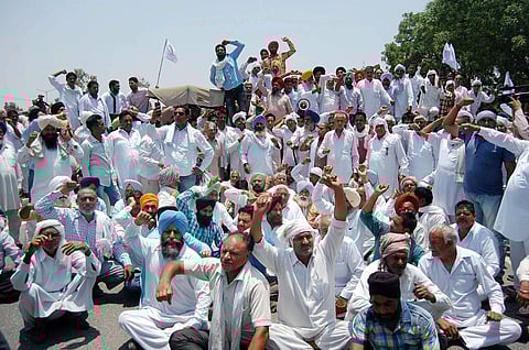 Farmers block the national highway during a protest against Mandsaur violence in Ambala Haryana on Friday. | PTI