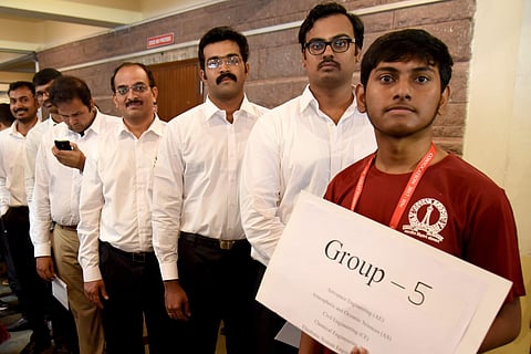 Meritorious Students, who won Medals at the Indian Institue of Science(IISc) show victory sign during the Convocation held in Bengaluru on Wednesday./NAGARAJA GADEKAL