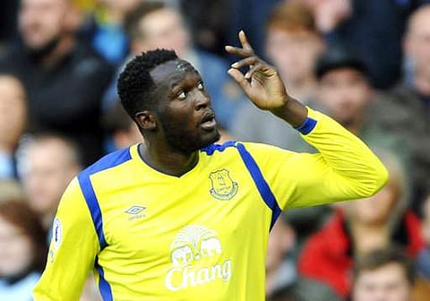 FILE - In this Saturday, Oct. 15, 2016 file photo, Everton's Romelu Lukaku celebrates after scoring during the English Premier League soccer match between Manchester City and Everton at the Etihad Stadium in Manchester, England. Manchester United is looki