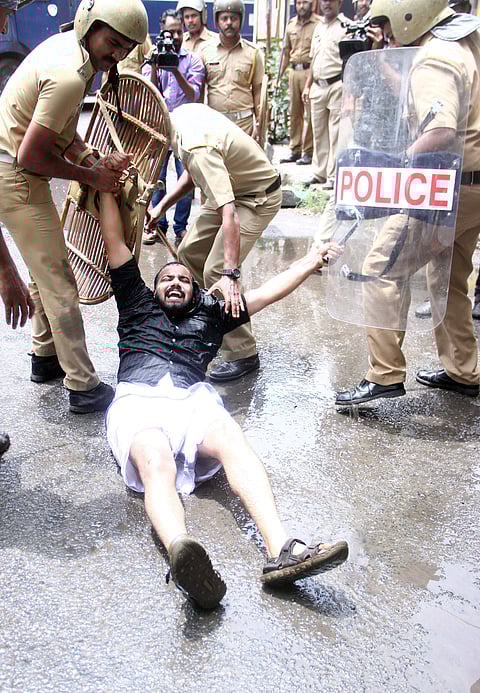 Police removing Youth Congress activists after they staged a march to the City Police Commissioner’s office against the government’s educational policy, in Kochi on Saturday. (EPS | Melton Antony)