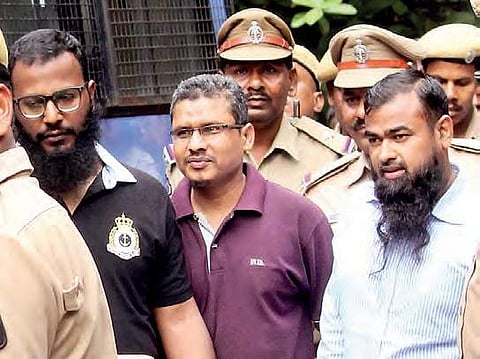 The acquitted persons in the 2005 suicide bomb blast walk out of the Nampally Court on Thursday | Express photo
