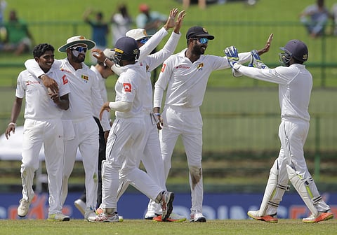 Sri Lankan cricket team celebrating after taking a wicket. (Photo | AP)