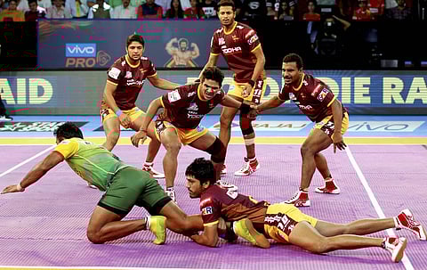 UP Yoddha and Patna Pirates players in action during the Pro Kabaddi League match in Ahmedabad on Sunday. | PTI