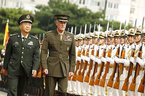 US Chairman of U.S. Joint Chiefs of Staff Joseph Dunford, right, and his Chinese counterpart, Chief of the General Staff of the People's Liberation Army Gen. Fang Fenghui, attend a welcoming ceremony in Beijing on August 15. (File Photo | AP)