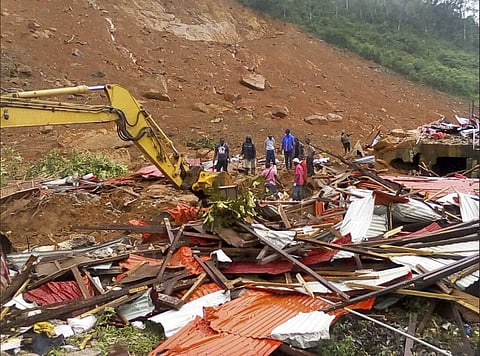 Sierra Leone, people survey the damage after mudslides in Regent, east of Freetown (AP)